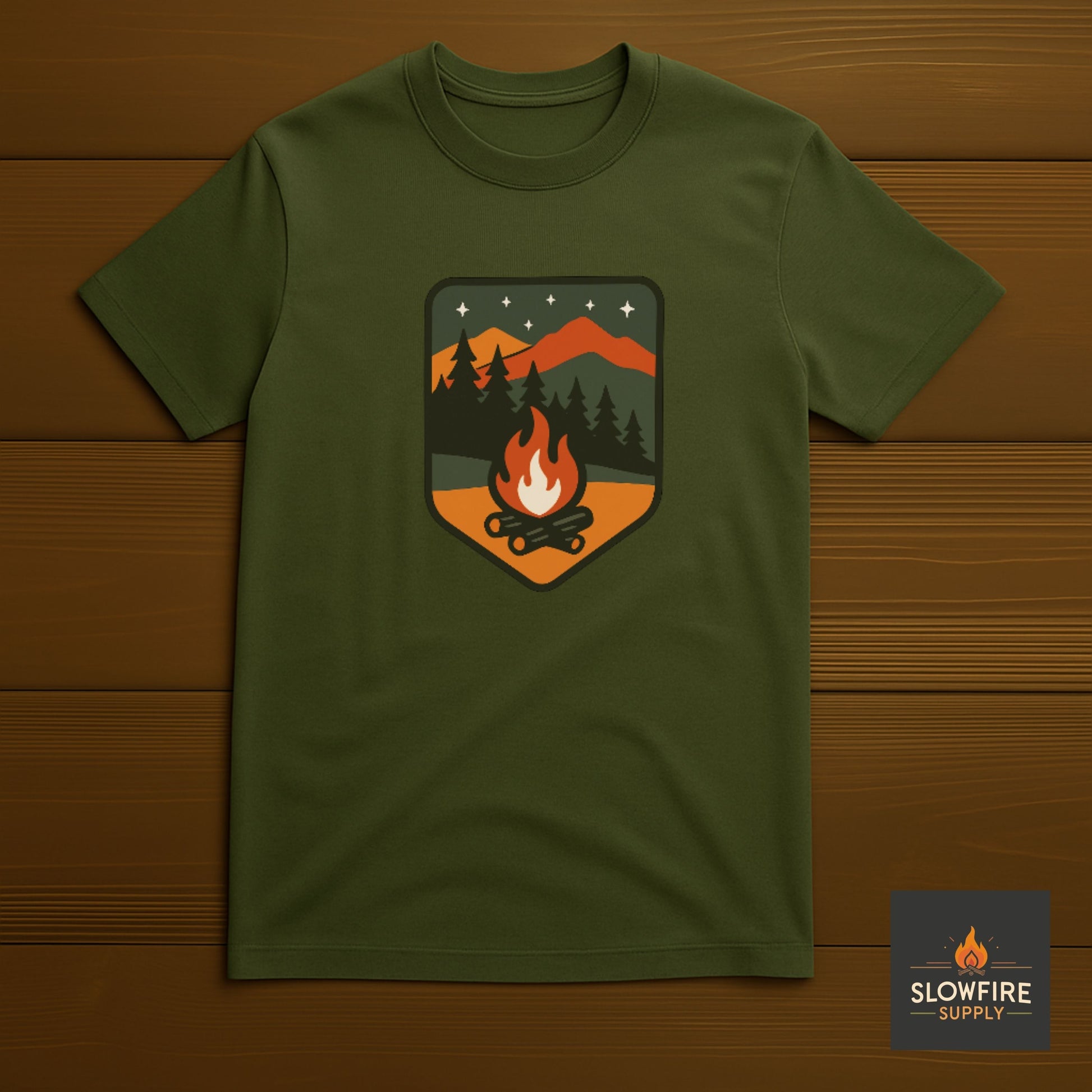 Military Green t-shirt with a camping graphic on a wooden background