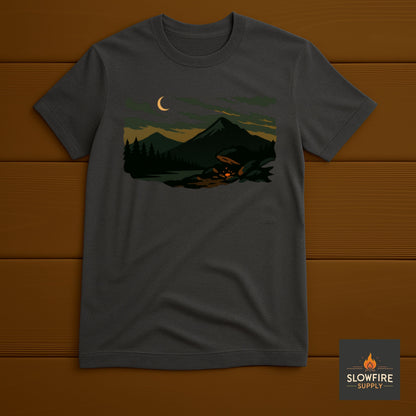 Dark gray t-shirt with a graphic of a forest scene and crescent moon on a wooden background, featuring the Slowfire Supply logo.
